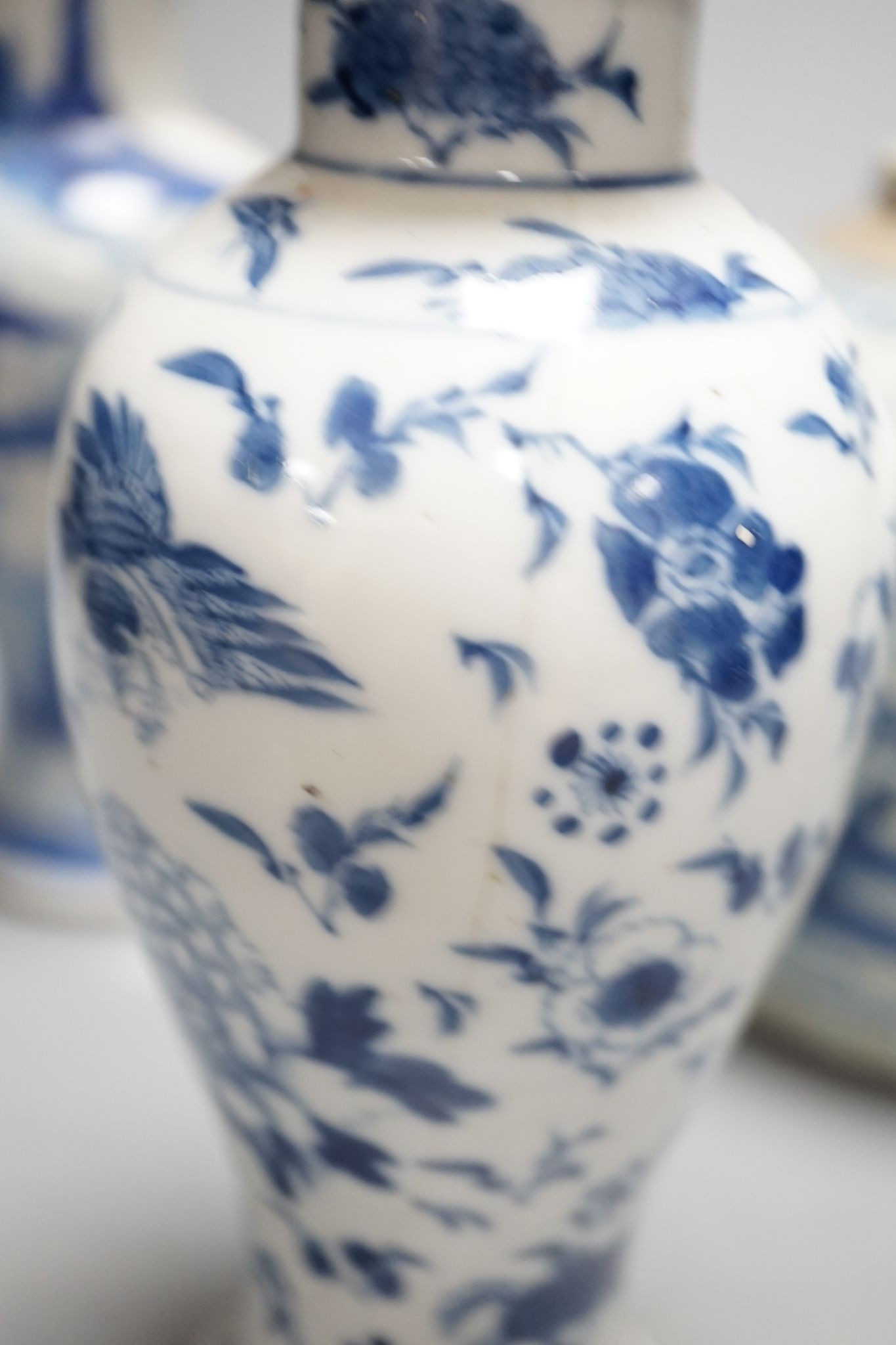 Twelve pieces of 19th century Chinese blue and white tableware and a small famille rose bowl, largest 20cm